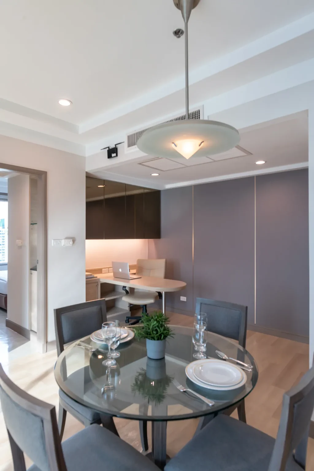 Kitchenette area inside a 1-bedroom hotel room in Bangkok.