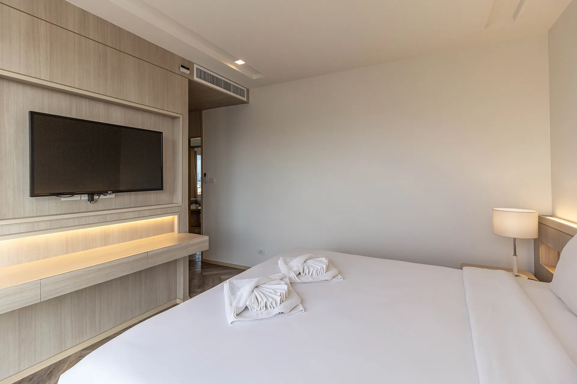 Two Bedroom Aparthotel Bangkok Hotel 5-star bedroom with bed.