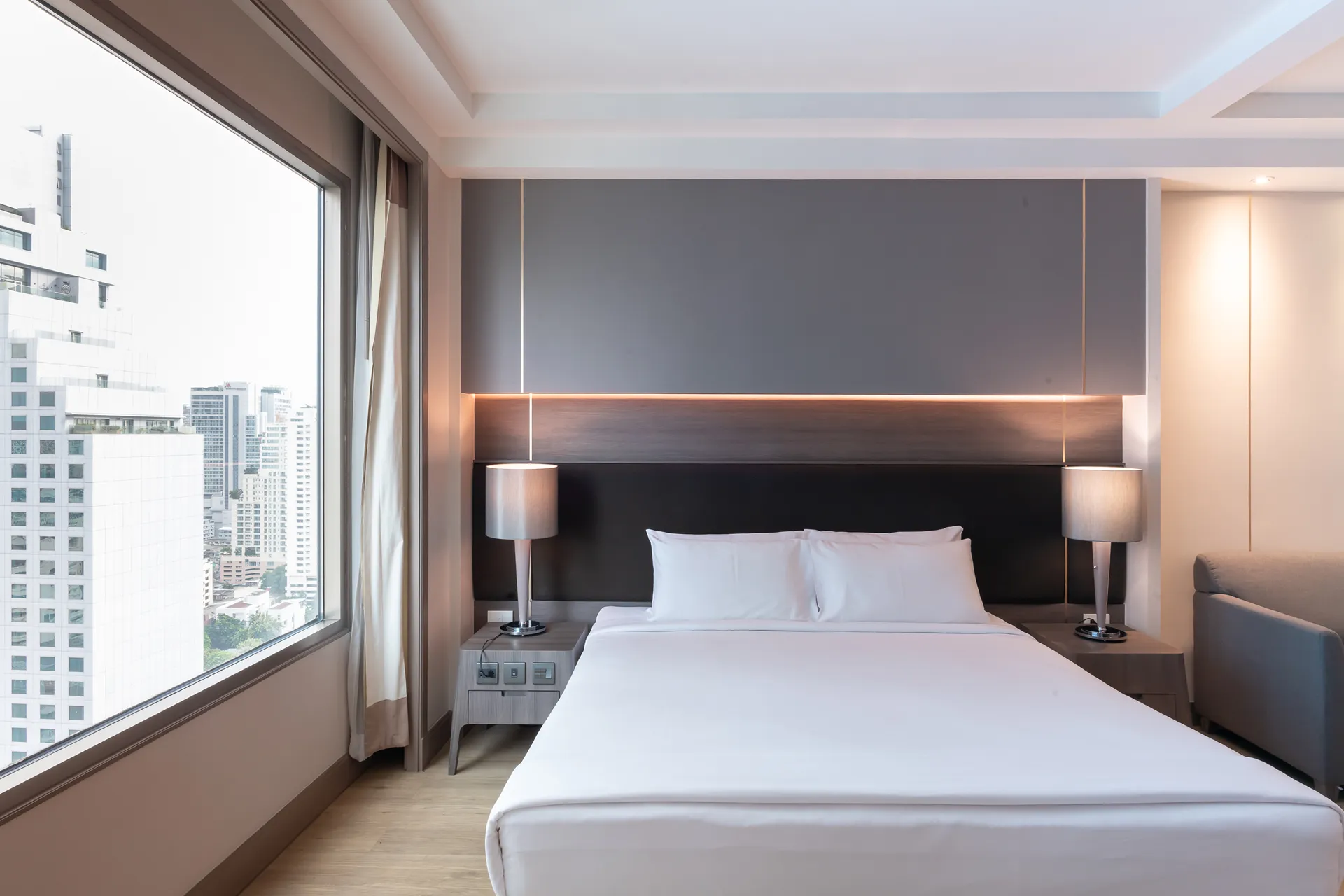 Modern studio interior with kitchen at a city hotel in Sukhumvit, Bangkok.