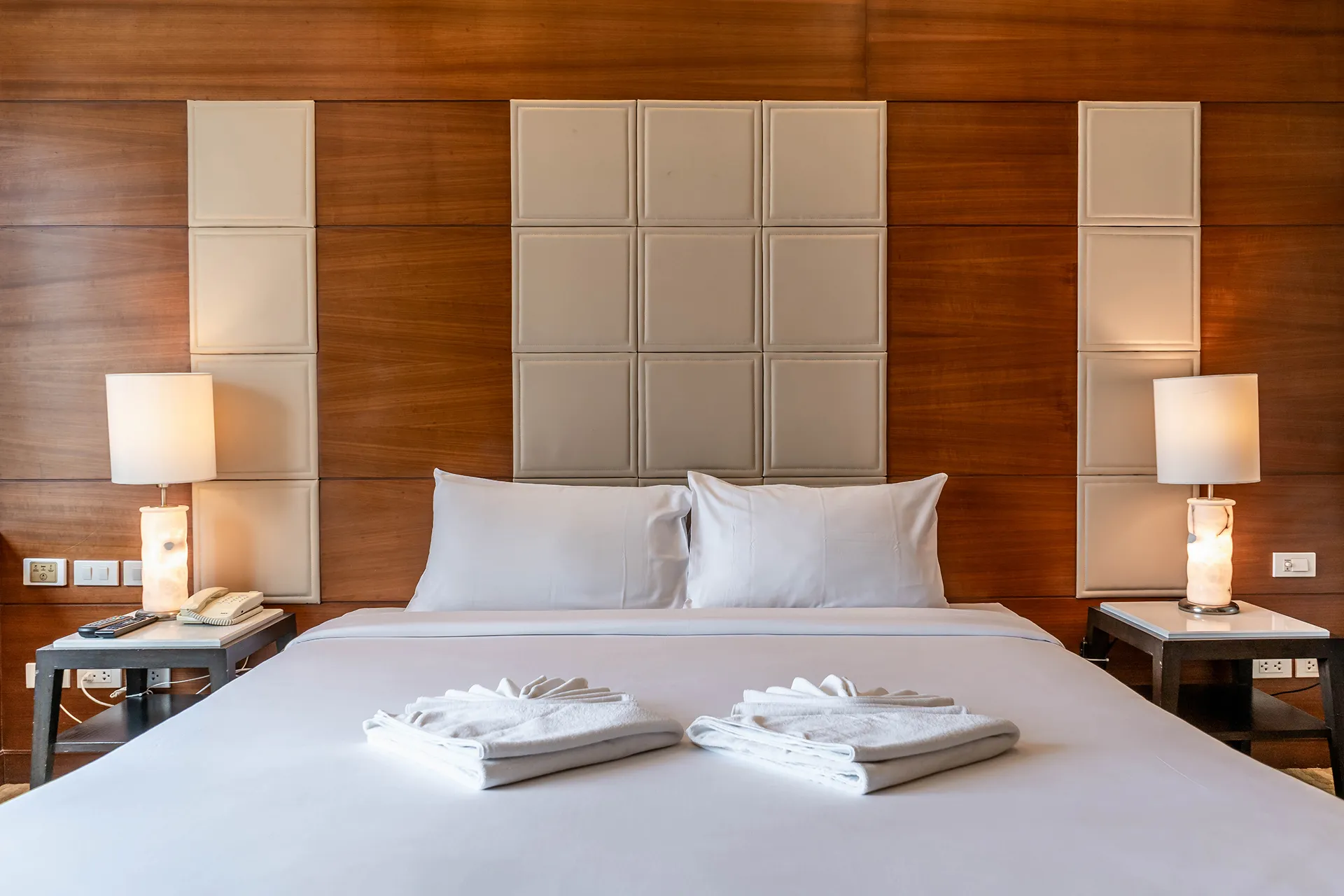 Luxury interior of a Sukhumvit suite with jacuzzi and kitchen.