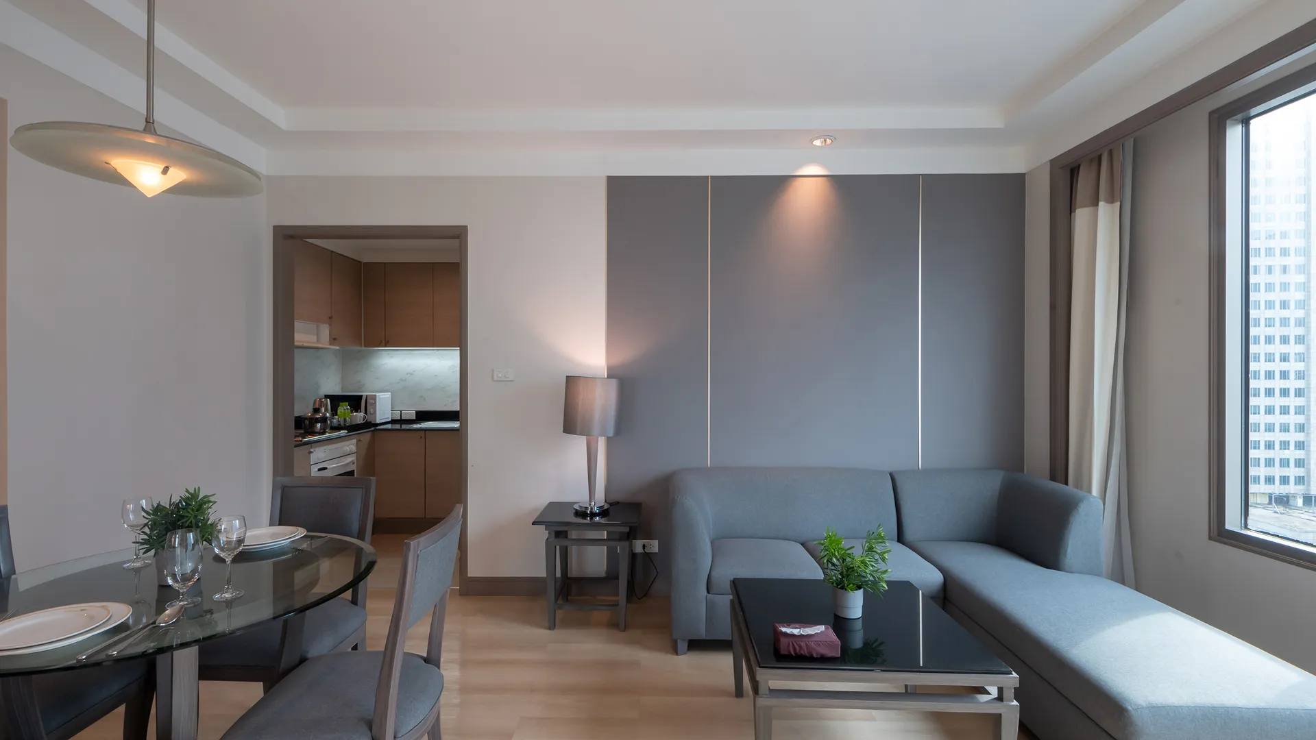 Two-bedroom suite with kitchen suitable for family stays in Bangkok.