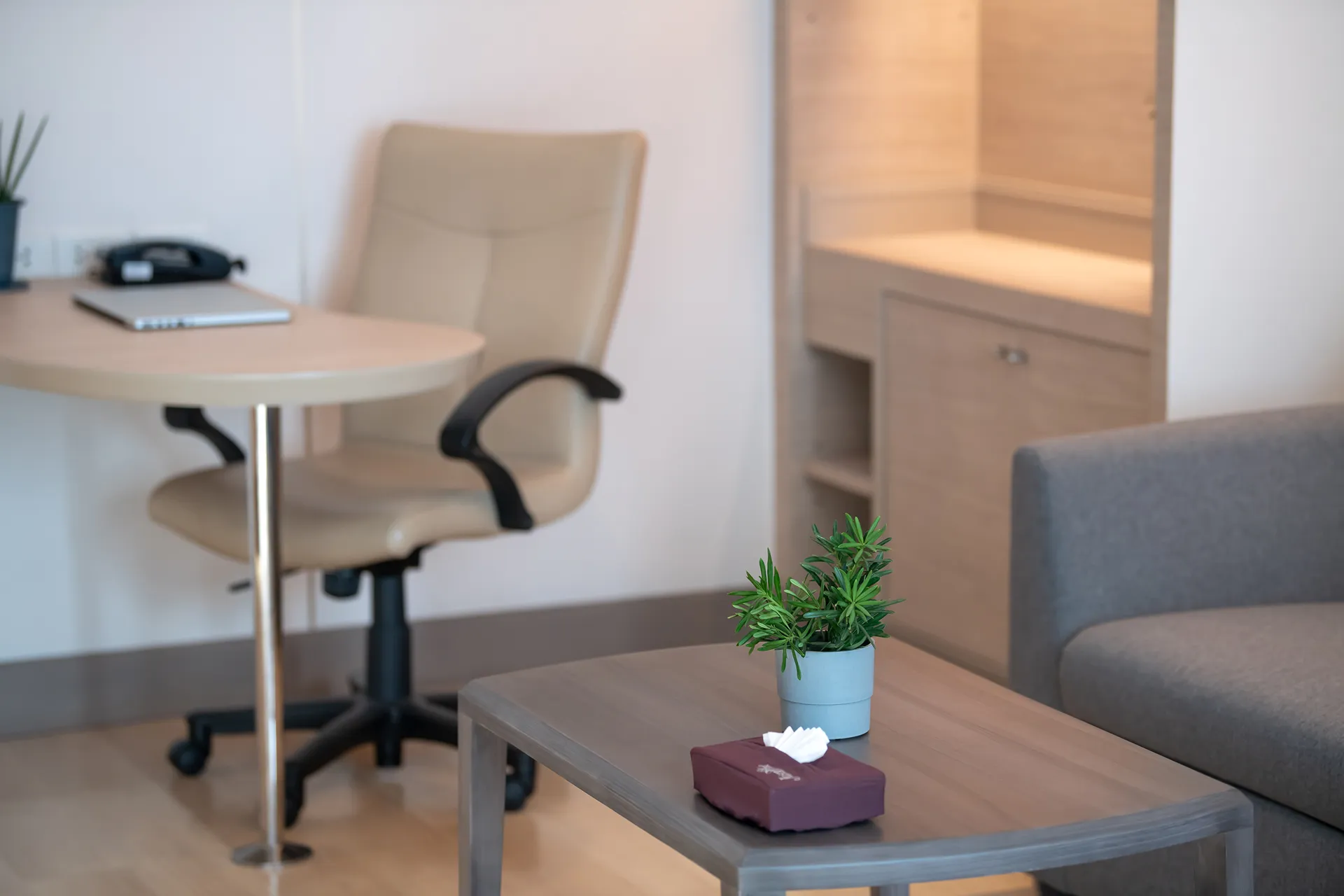 Master bedroom in a two-bedroom suite with kitchen at a Bangkok hotel.