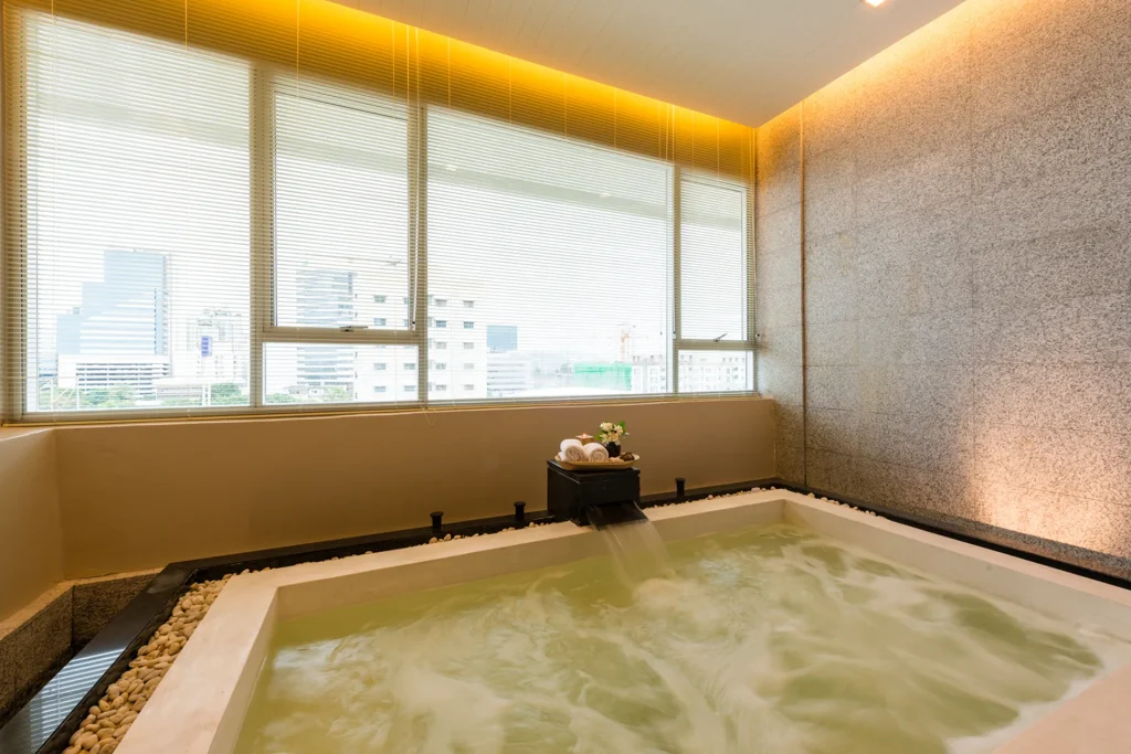 An indoor jacuzzi at a Bangkok hotel with a relaxing private atmosphere.