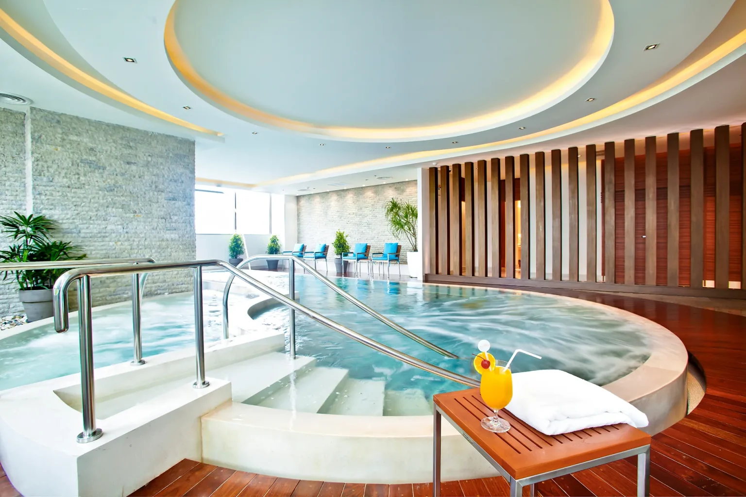 An indoor heated hydro-massage pool at a hotel with Bangkok wellness facilities.
