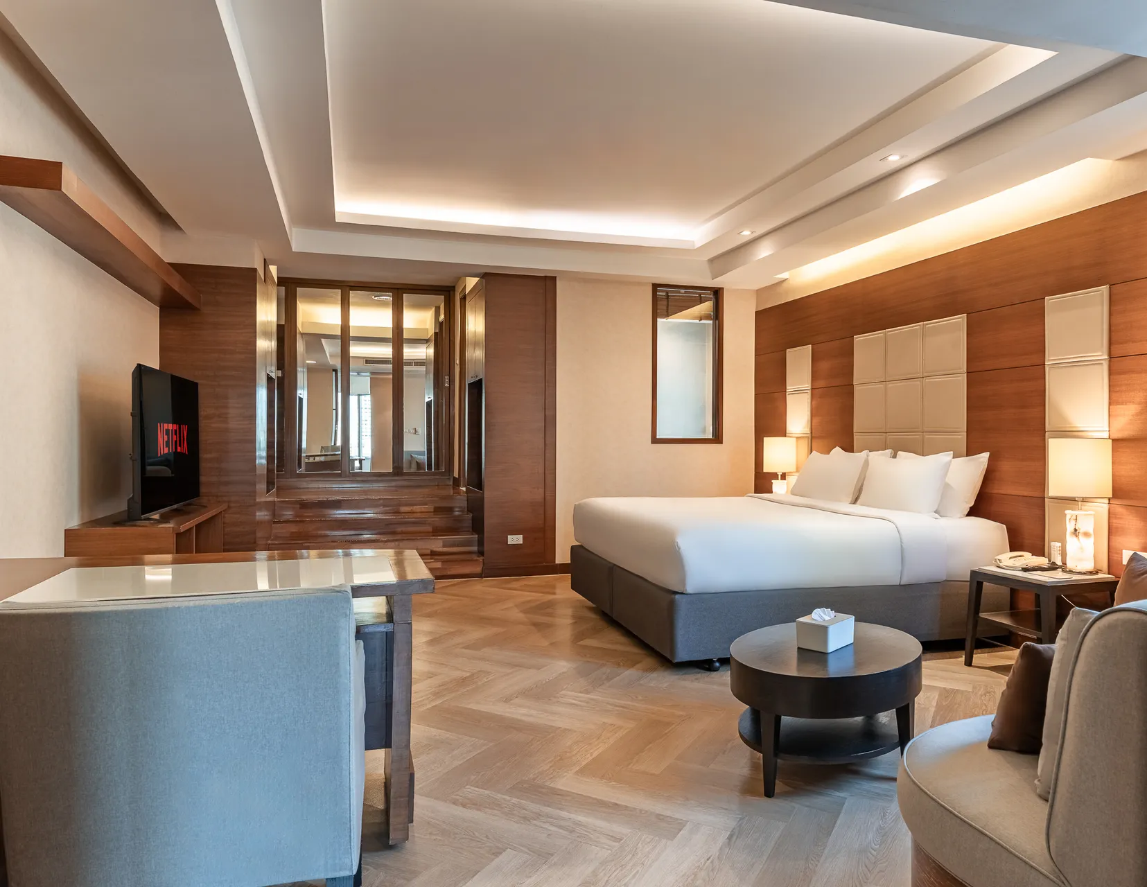 Premium hotel suite in Sukhumvit featuring a Jacuzzi, kitchen, and spacious living area