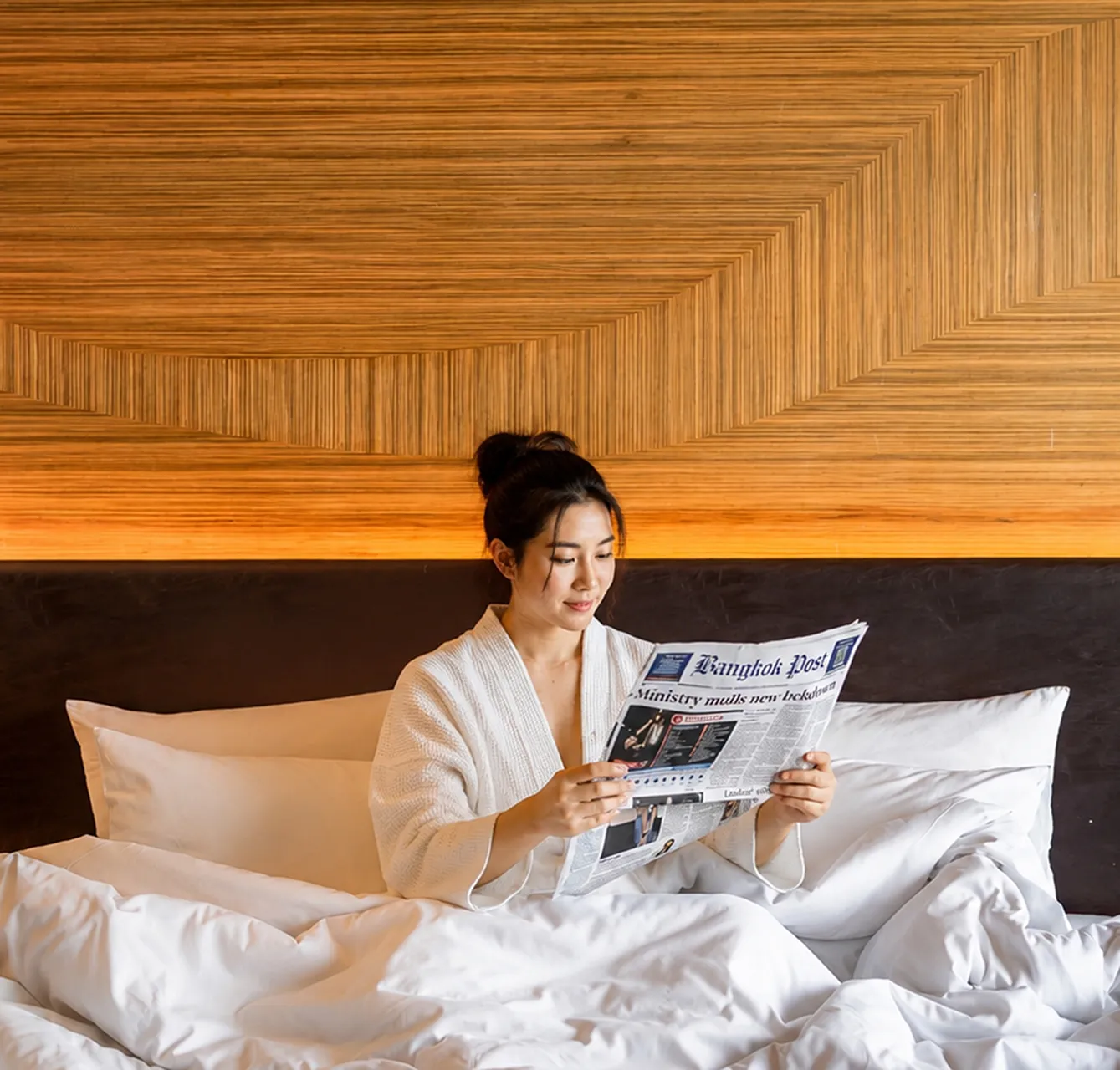 Guest relaxing in spacious long-stay accommodation in Sukhumvit, Bangkok.