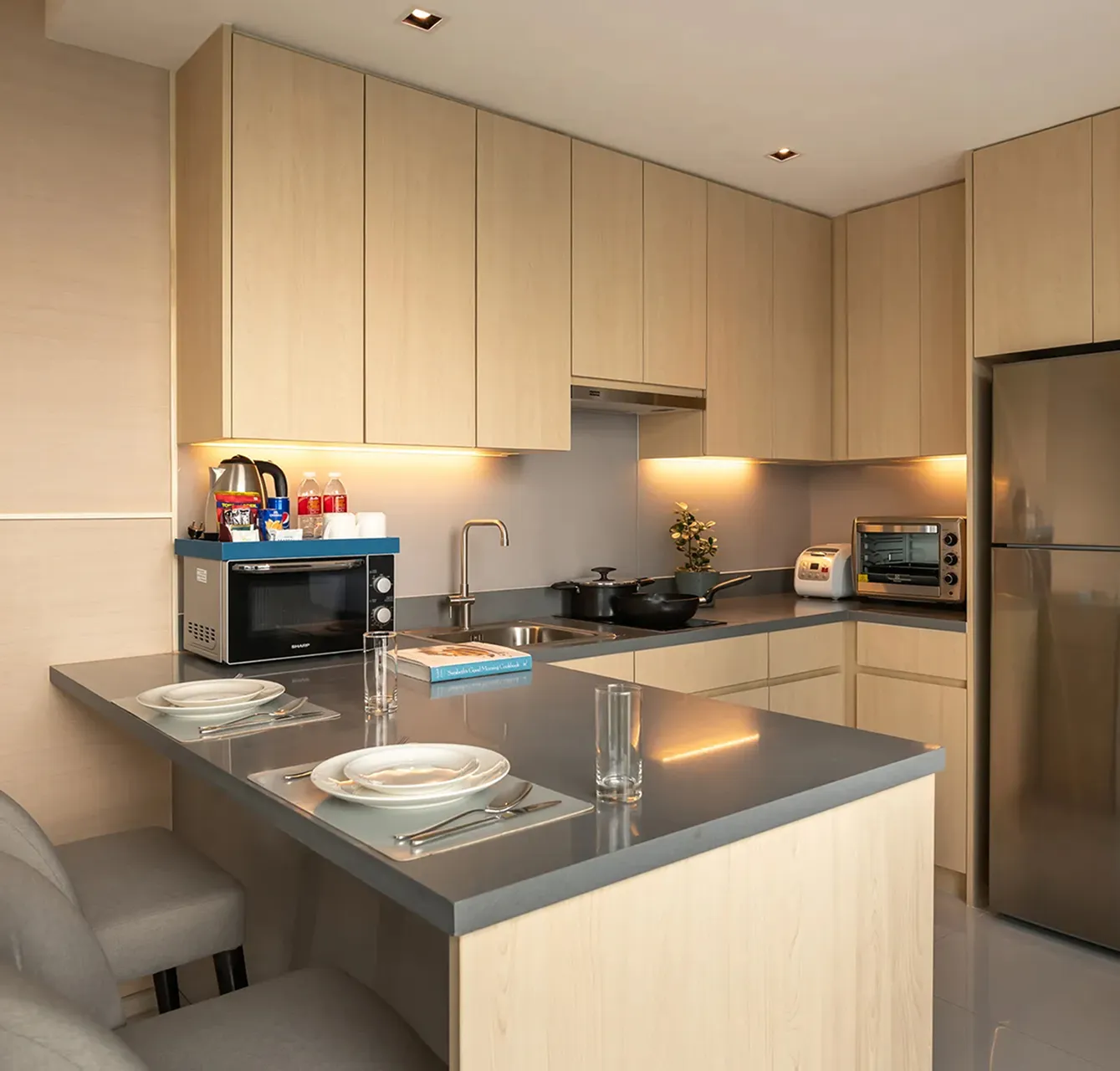 Fully equipped kitchen for guests staying at a long-stay hotel in Bangkok.